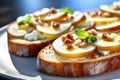 Bruschetta with caramelized pears and cheese, delicious crostini for gourmet breakfast, brunch or lunch Royalty Free Stock Photo