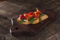 Bruschetta with cheese, arugula and strawberries