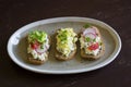 Bruschetta with cheese, radish, cucumber and cherry tomatoes