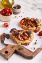 Bruschetta with ciabatta bread, mozzarella cheese, champignon mushrooms and cherry tomatoes Royalty Free Stock Photo