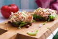 Bruschetta with crab salad served on wooden board Royalty Free Stock Photo