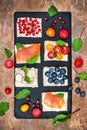 Bruschetta crostini appetizers mix set with various toppings. Variety of small sweet and sour breakfast sandwiches Royalty Free Stock Photo