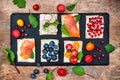 Bruschetta crostini appetizers mix set with various toppings. Variety of small sweet and sour breakfast sandwiches Royalty Free Stock Photo