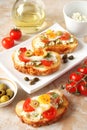 Bruschetta, crostini with cream cheese, with cherry tomatoes, he