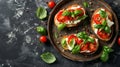 Bruschetta with fresh ricotta cheese and cherry tomatoes on wooden board decorated with basil leaves. Closeup view Royalty Free Stock Photo