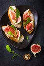 Bruschetta with goat cheese, figs, prosciutto and arugula