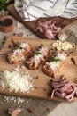 Bruschetta: homemade sheep`s cheese, bacon, sauerkraut, garlic, homemade bread, herbs and spices. Italian food Royalty Free Stock Photo