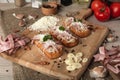 Bruschetta: homemade sheep`s cheese, bacon, sauerkraut, garlic, homemade bread, herbs and spices. Italian food Royalty Free Stock Photo