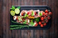 Bruschetta with meat, olives, herbs and parmesan cheese on bread. Cold snacks. Italian cuisine. Royalty Free Stock Photo