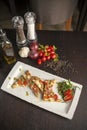 Bruschetta with pesto sauce and arugula