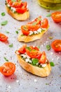 Bruschetta with pesto sauce, feta cheese, tomatoes and basil Royalty Free Stock Photo