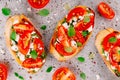 Bruschetta with pesto sauce, feta cheese, tomatoes and basil Royalty Free Stock Photo