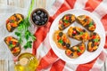 Bruschetta with pieces of fish on white plate Royalty Free Stock Photo