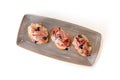 Bruschetta with prosciutto, capers and tomatoes on ciabatta toast isolated Royalty Free Stock Photo
