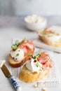 Bruschetta with prosciutto and cream cheese. Bread with smoked bacon and cream cheese. Toasted bread slice with meat and cream Royalty Free Stock Photo