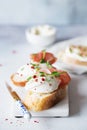 Bruschetta with prosciutto and cream cheese. Bread with smoked bacon and cream cheese. Toasted bread slice with meat and cream Royalty Free Stock Photo