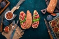 Bruschetta with prosciutto, fresh figs and cheese. On the old background. Healthy food. Free space for text. Royalty Free Stock Photo