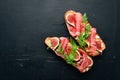 Bruschetta with prosciutto, fresh figs and cheese. On the old background. Healthy food. Free space for text. Royalty Free Stock Photo