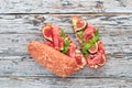 Bruschetta with prosciutto, fresh figs and cheese. On the old background. Healthy food. Free space for text. Royalty Free Stock Photo