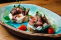 Bruschetta with roast beef. Royalty Free Stock Photo