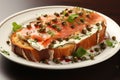 Bruschetta with salmon. Breakfast toast with cream cheese, salmon, capers and greens on a plate, macro close-up. Keto