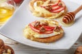 Bruschetta sandwiches with brie or Camembert cheese, apples, walnuts and honey