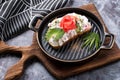 Bruschetta, a slice of bread with cheese paste, tomato and cucumber.