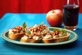 bruschetta slices with apple and gorgonzola against a vibrant red background