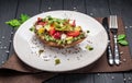 Bruschetta with sun-dried tomatoes, cream cheese, avocado and fresh vegetables Royalty Free Stock Photo