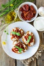 Bruschetta with sun-dried tomatoes, goat cheese and basil Royalty Free Stock Photo