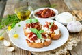 Bruschetta with sun-dried tomatoes, goat cheese and basil Royalty Free Stock Photo