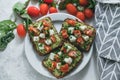 Bruschetta toast with guacamole and tomatoes