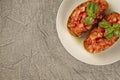 Bruschetta (toasted bread) with tomato and basil on the plate. Royalty Free Stock Photo