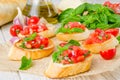 Bruschetta with tomato, onion, cheese and fresh basil Royalty Free Stock Photo