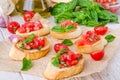 Bruschetta with tomato, onion, cheese and fresh basil Royalty Free Stock Photo