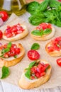 Bruschetta with tomato, onion, cheese and fresh basil Royalty Free Stock Photo