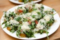 Bruschetta with Tomatoes, Greens, and Shaved Parmesan