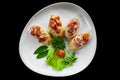 Bruschetta with tomatoes, ham,onion and olive oil on white plate close up Royalty Free Stock Photo