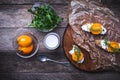 Bruschetta with tomatoes, joghurt and rucola on board