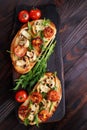 Bruschettas with grilled vegetables and arugula.