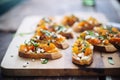 bruschettas with roasted pumpkin and feta on parchment