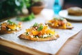 bruschettas with roasted pumpkin and feta on parchment