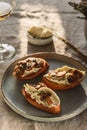 Bruschettas or toasts with cheese and fried mushrooms