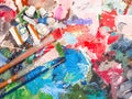 Brush and bright oil-paint palette for background Royalty Free Stock Photo