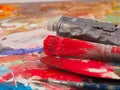 Brush and bright oil-paint palette for background Royalty Free Stock Photo