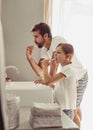 Brush, brush and brush some more. a father and his daughter in the bathroom. Royalty Free Stock Photo