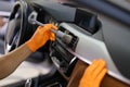 Brush cleaning of dust from car interior parts