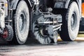 Brush cleaning roads wheels of the harvesting machine.