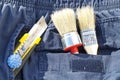 Brush and knife in pocket Royalty Free Stock Photo