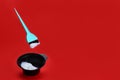brush levitates over a bowl of hair dye Royalty Free Stock Photo
